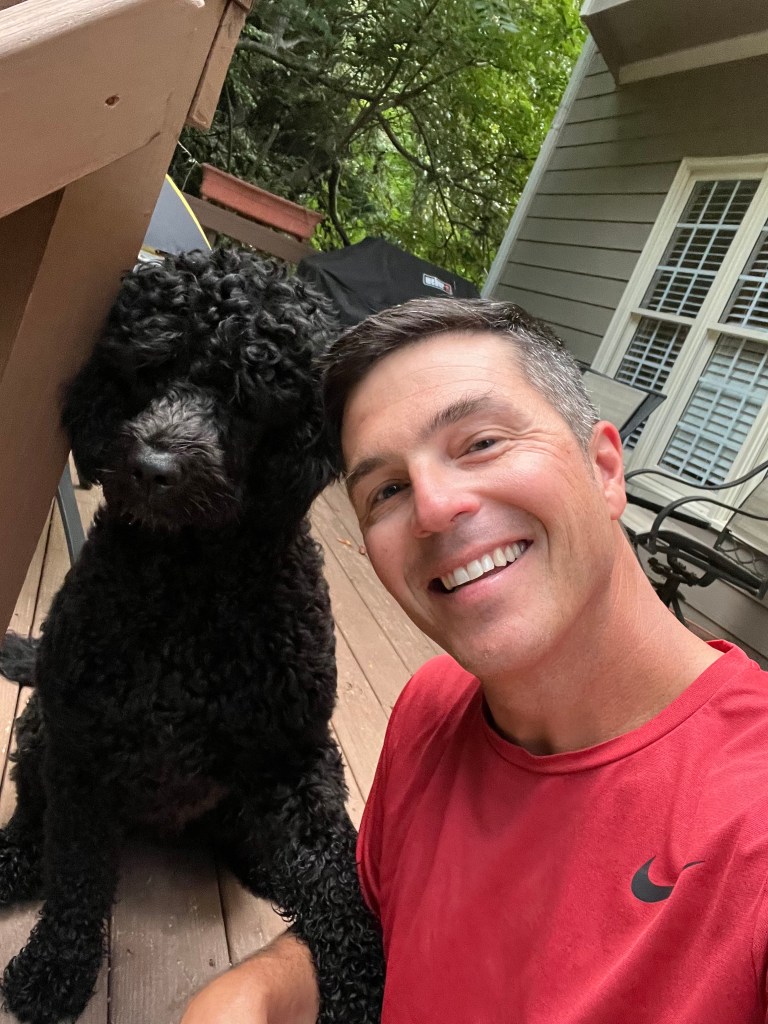 Luna and Josh smiling for a post-run photo.